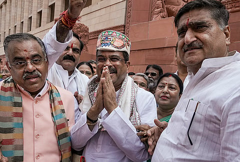 Former Union Education Minister Dharmendra Pradhan being greeted during the Monsoon session of Parliament, in New Delhi.