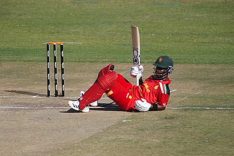 Zimbabwe's batsman Dion Myers falls to the ground after avoiding a run out during the third T20 cricket match between Zimbabwe and India in Harare, Zimbabwe.