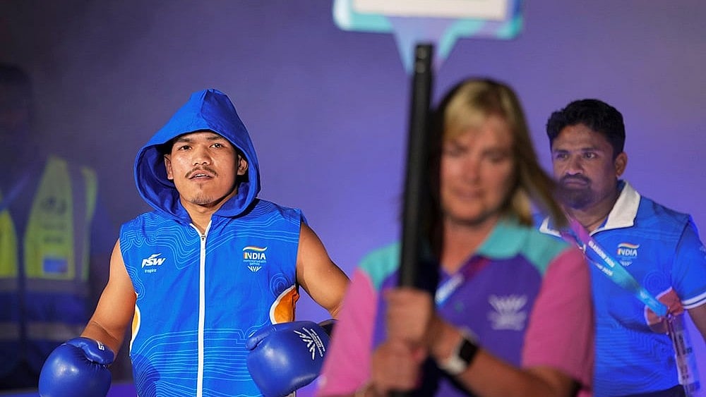 India's Jadumani Singh Mandengbam makes his way to the ring ahead of his men's 55kg Round of 32 boxing bout at the Commonwealth Games 2026, in Glasgow.  - | Photo: PTI/Ravi Choudhary