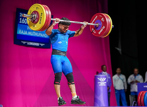 India's Raja Mathupandi competes during the men's 65kg weightlifting final at the 23rd Commonwealth Games, in Glasgow, Scotland.