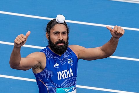 India's Gurindervir Singh competes in the men's 100m round 1 heat 4 athletics at the 23rd Commonwealth Games, in Glasgow, Scotland. India's fastest man Gurindervir Singh was well below his personal best as he finished second in his men's 100m opening-round heat, clocking 10.39 seconds, on the opening day of athletics competition. 