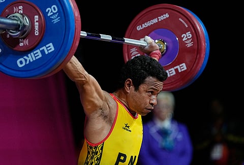 Papua New Guinea Baru Morea competes in the men 65 kilogram weightlifting during the Commonwealth Games in Glasgow, Scotland, Sunday, July 26, 2026.