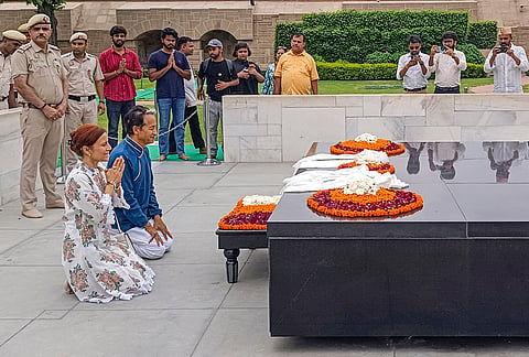 Activist Sonam Wangchuk, with his wife Gitanjali J Angmo, pays tributes to Mahatma Gandhi, after being discharged from Medanta Hospital, at Rajghat in New Delhi.