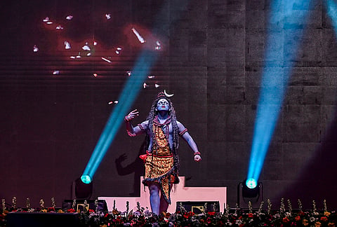 An artist dressed as Lord Shiva performs during the opening ceremony of the Commonwealth Table Tennis Championships 2026, at Thyagraj Stadium, in New Delhi.