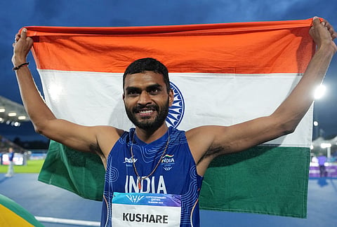 Sarvesh Anil Kushare, of India, poses after winning the silver medal in the men's high jump final at the Commonwealth Games in Glasgow, Scotland, Monday, July 27, 2026. 