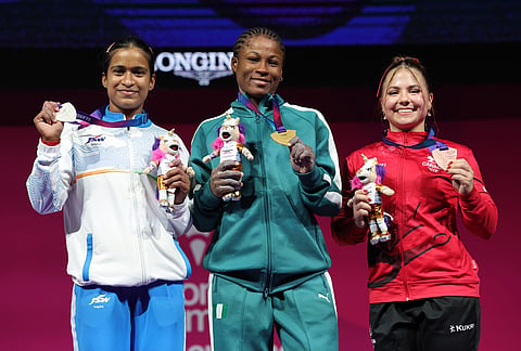 From left, Silver medal winner Gyaneshwari Yadav of India, gold medal winner Onome Omolola Didih of Nigeria and bronze medal winner Rebeka Groulx of Canada, following the women's weightlifting 53kg snatch and the clean and jerk rounds during day four of the 2026 Commonwealth Games in Glasgow, Scotland, Monday, July 27, 2026. 