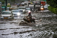 | Photo: PTI/Salman Ali : Vehicles move through a waterlogged road amid heavy rain, in the ITO area, New Delhi, Tuesday, July 28, 2026. IMD issued an orange alert in the national capital for the next few hours. 