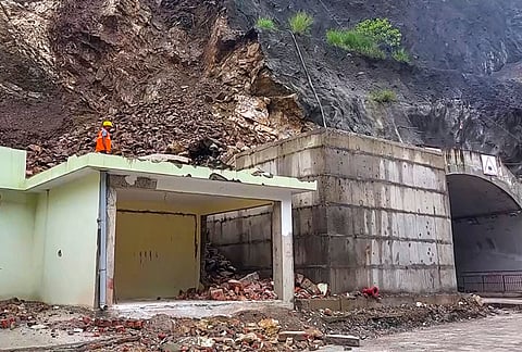 An official present at the site after a major hillside collapse occurred over the outer section of an under-construction tunnel project, damaging a residential complex, in Rudraprayag, Uttarakhand.