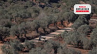 Why Are Israeli Settler Attacks Increasing In The West Bank? | IMAGO/ Middle East : A burned-out vehicle sits on a dirt road among olive trees in the village of Baita, south of Nablus in the West Bank. Tensions have risen in the area as settlers and Israeli forces confront Palestinians