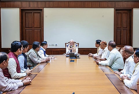 Prime Minister Narendra Modi meets MPs from Assam and discusses the prevailing flood situation in various parts of the state, in New Delhi. Assam BJP President Dilip Saikia is also seen. 
