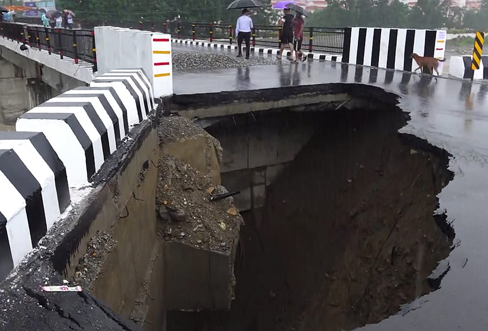 Weather: Road caves in after heavy rain