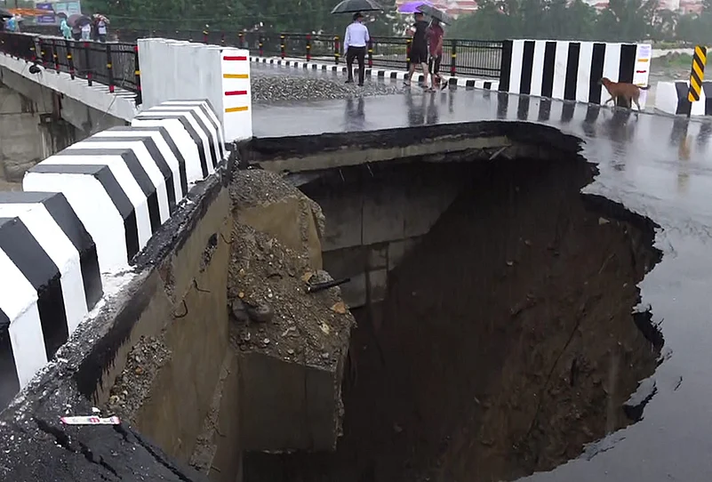 Weather: Road caves in after heavy rain