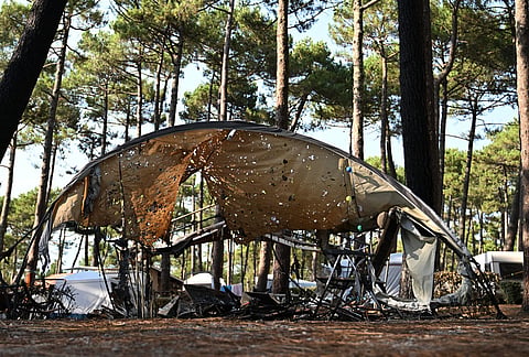 A tent is pockmarked from burning embers at a campsite after wildfires raged in Lège-Cap-Ferret, outside Bordeaux, France, Monday, July 27, 2026.