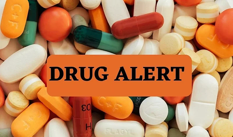 Pharmaceutical drugs in background with the text Drug Alert in front