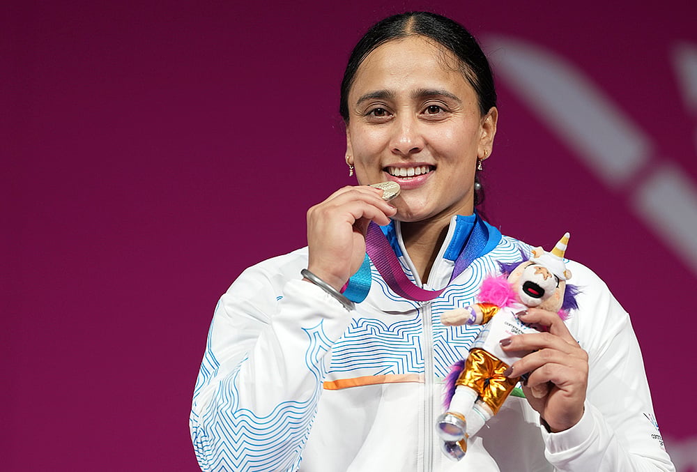| Photo: PTI/Ravi Choudhary : Silver medallist Indias Harjinder Kaur poses for photographs during the presentation ceremony after the womens 69kg weightlifting event at the 23rd Commonwealth Games, in Glasgow, Scotland, Tuesday, July 28, 2026. 