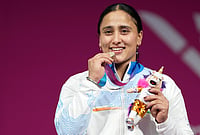 | Photo: PTI/Ravi Choudhary : Silver medallist India's Harjinder Kaur poses for photographs during the presentation ceremony after the women's 69kg weightlifting event at the 23rd Commonwealth Games, in Glasgow, Scotland, Tuesday, July 28, 2026. 