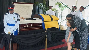 Kerrie Eversley/AP Photo : Members of the honor guard stand watch over the casket of Garry Sobers as people pay their final respects at the Kensington Oval in Bridgetown, Barbados.