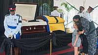 Kerrie Eversley/AP Photo : Members of the honor guard stand watch over the casket of Garry Sobers as people pay their final respects at the Kensington Oval in Bridgetown, Barbados.