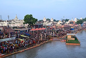 | Photo: PTI : People take a holy dip in the Saryu river on the occasion of 'Guru Purnima' festival, at Shiva Temple, in Ayodhya, Uttar Pradesh.