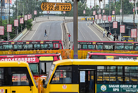 A road is blocked with buses by the police to stop farmers under the banner of Samyukt Kisan Morcha marching as part of a protest to press for various demands, including 100 per cent moong procurement at MSP, in Bhopal, Madhya Pradesh, Wednesday, July 29, 2026. 
