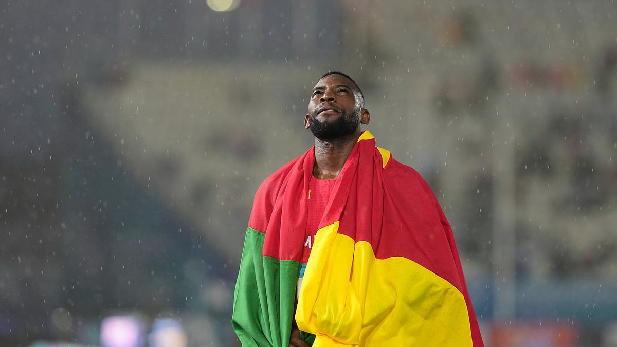 Emmanuel Eseme, of Cameroon, reacts after winning the gold medal in the men's 100 meters final at the Commonwealth Games in Glasgow, Scotland, Tuesday, July 28, 2026. - (AP Photo/Eranga Jayawardena)