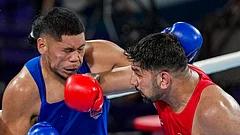 India's Narender Berwal (red) in action against Samoa's Michael Seko during their men's 90+kg super-heavyweight quarter-final boxing bout at the Commonwealth Games 2026, in Glasgow, Scotland, Wednesday, July 29, 2026. Berwal secured a 3-2 split-decision victory to advance to the semi-finals. - (PTI Photo/Ravi Choudhary)