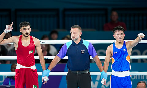 India's Jadumani Singh Mandengbam, right, after defeating Pakistan’s Sumama Rehman during the men's 55kg boxing round of 16 at the 23rd Commonwealth Games, in Glasgow, Scotland, Sunday, July 26, 2026. 