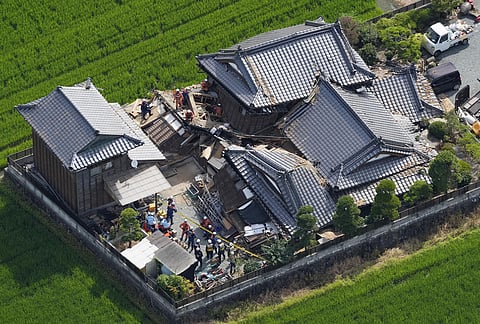This aerial image shows rescuers working at the house collapsed by an earthquake, in Hikawa, Kumamoto Prefecture, on Wednesday, July 29, 2026. 