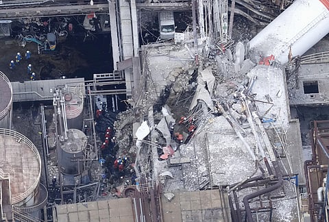 This aerial image shows rescue operation as a chimney was collapsed at the Nippon Paper Industries Co.’s Yatsushiro factory, following an earthquake in Yatsushiro, Kumamoto Prefecture, Wednesday, July 29, 2026. 