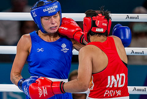 India's Priya Ghanghas, red, and Scotland's Niamh Mitchell in action during the Women's 60kg quarter-final boxing match at the Commonwealth Games 2026, in Glasgow, Scotland, Tuesday, July 28, 2026. 