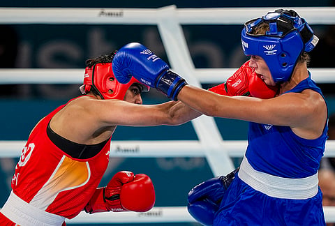 India's Priya Ghanghas, red, and Scotland's Niamh Mitchell in action during the Women's 60kg quarter-final boxing match at the Commonwealth Games 2026, in Glasgow, Scotland, Tuesday, July 28, 2026. 