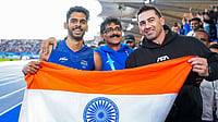 From Crutches To Commonwealth Games Silver: Sreeshankar's Remarkable Second Act | Photo: PTI/Ravi Choudhary : India's Murali Sreeshankar celebrates with his coach and father, S Murali, centre, a former South Asian Games triple jump silver medallist, after winning the silver medal in the men's long jump final at the Commonwealth Games 2026, in Glasgow, Scotland, Thursday, July 30, 2026.