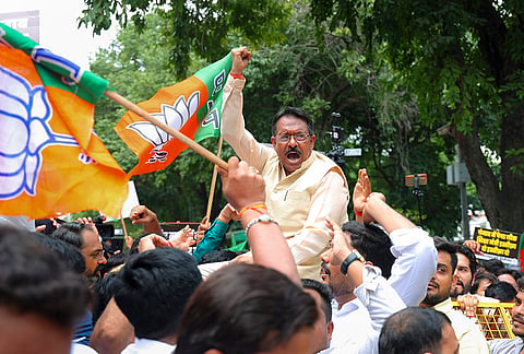 Delhi BJP President Harsh Malhotra and party supporters stage a protest at Aam Aadmi Party office demanding the resignation of Punjab Education Minister Harjot Singh Bains over alleged paper leaks in the state, in New Delhi.