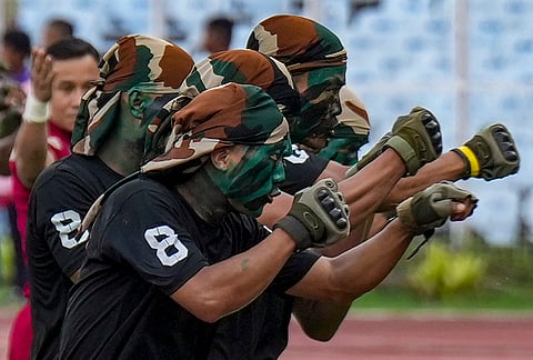 Soldiers perform during the opening ceremony of the 135th Durand Cup, before a Derby match between East Bengal FC and Mohun Bagan Super Giant, in Kolkata, Saturday, July 25, 2026. 
