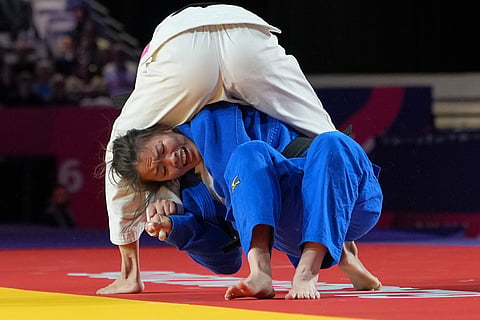 India's Asmita Dey, top, and Heidi Quach of Canada compete in the Women's 48kg Judo final at the Commonwealth Games in Glasgow, Scotland, Friday, July 31, 2026.