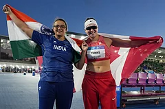 India's Seema, left, and Canada's Julia Tunks celebrate after winning the women's discus throw final at the Commonwealth Games in Glasgow, Scotland, Thursday, July 30, 2026. - | Photo: AP/Alastair Grant