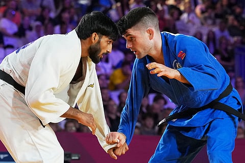 India's Harsh Singh, left, and Australia's Joshua Katz compete in the men's 60kg judo gold medal match at the Commonwealth Games in Glasgow, Scotland, Friday, July 31, 2026.