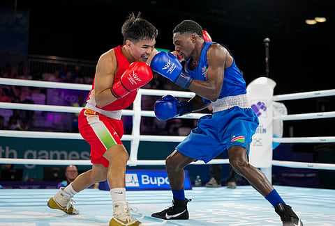 India's Jadumani Singh Mandengbam, red, and Namibia's Philip Pumulo Mutakela Haoseb in action during the Men's 55kg boxing semifinal at the Commonwealth Games 2026, in Glasgow, Scotland, Friday, July 31, 2026.