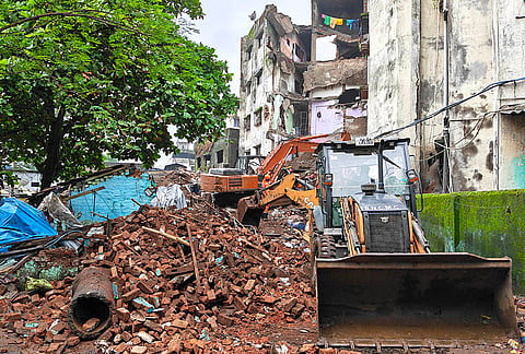 Mud, debris and earthmoving machinery at the site where a portion of the Kohinoor Building in Balaji Nagar area of the powerloom town collapsed on late Thursday, in Bhiwandi, Maharashtra. One person was killed, seven to eight persons are trapped under the rubble. 