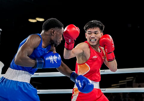 India's Jadumani Singh Mandengbam, red, and Namibia's Philip Pumulo Mutakela Haoseb in action during the Men's 55kg boxing semifinal at the Commonwealth Games 2026, in Glasgow, Scotland, Friday, July 31, 2026.