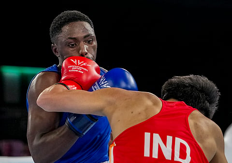 India's Jadumani Singh Mandengbam, red, and Namibia's Philip Pumulo Mutakela Haoseb in action during the Men's 55kg boxing semifinal at the Commonwealth Games 2026, in Glasgow, Scotland, Friday, July 31, 2026.