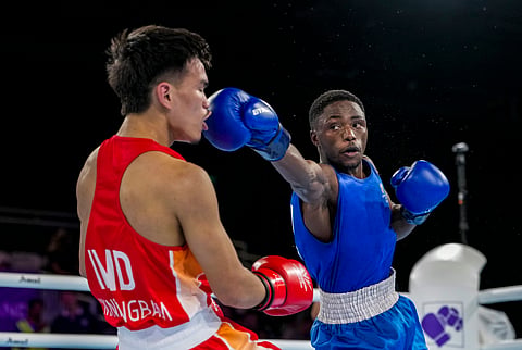 India's Jadumani Singh Mandengbam, red, and Namibia's Philip Pumulo Mutakela Haoseb in action during the Men's 55kg boxing semifinal at the Commonwealth Games 2026, in Glasgow, Scotland, Friday, July 31, 2026.