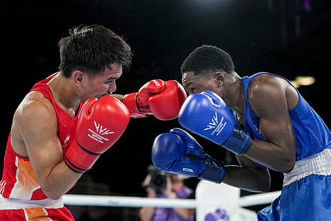 India's Jadumani Singh Mandengbam, red, and Namibia's Philip Pumulo Mutakela Haoseb in action during the Men's 55kg boxing semifinal at the Commonwealth Games 2026, in Glasgow, Scotland, Friday, July 31, 2026.