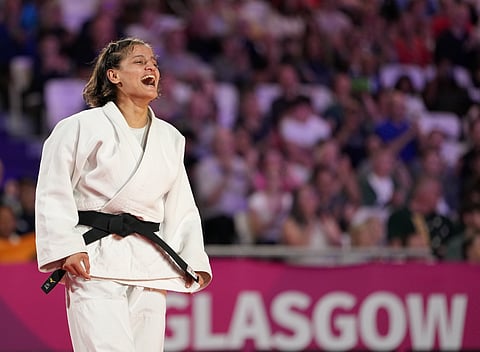 India's Asmita Dey celebrates after defeating Canada's Heidi Quach to win the gold medal in the Women's 48kg judo event at the Commonwealth Games 2026, in Glasgow, Scotland, Friday, July 31, 2026. Asmita became the first Indian judoka to win a Commonwealth Games gold medal.