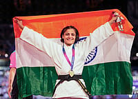 Historic First For India: Asmita Dey Strikes Commonwealth Judo Gold For India (PTI Photo/Ravi Choudhary) : India's Asmita Dey celebrates with the national flag after winning the gold medal in the Women's 48kg judo event at the Commonwealth Games 2026, in Glasgow, Scotland, Friday, July 31, 2026. Asmita became the first Indian judoka to win a Commonwealth Games gold medal.