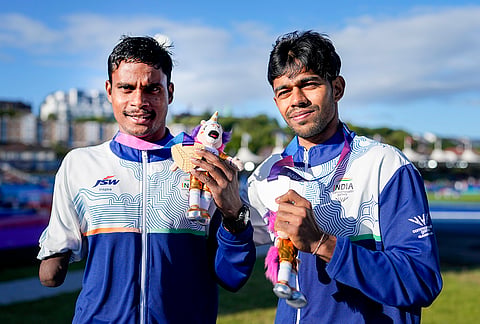 India's Dilip Mahadu Gavit, left, gold medallist, and Mohammed Basil Morssinganakath, silver medallist, pose with their medals after the Men's 100m T47 para-athletics event during the Commonwealth Games 2026, in Glasgow, Scotland, Thursday, July 30, 2026. 