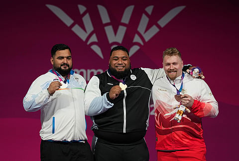 From left, silver medalist India's Lovepreet Singh, gold medalist, New Zealand's David Liti , bronze medalist England's Andrew Griffith in the men's +110kg Weightlifting Final at the Commonwealth Games in Glasgow, Scotland, Thursday, July 30, 2026. 