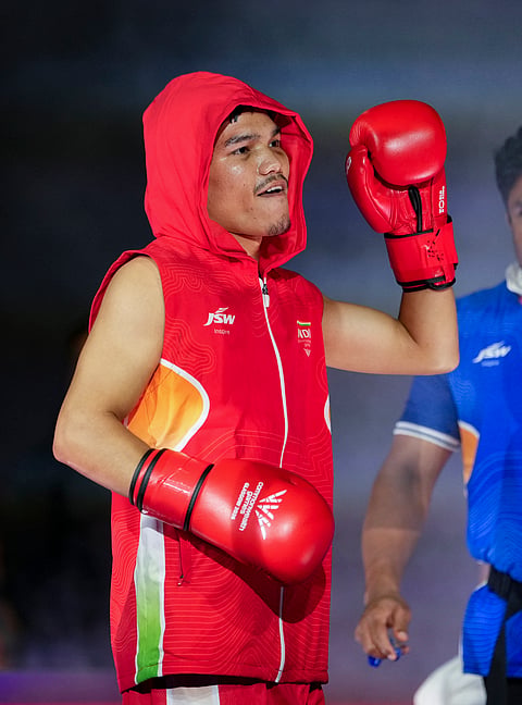 India's Jadumani Singh Mandengbam makes his way to the ring for his Men's 55kg boxing semifinal bout against Namibia's Philip Pumulo Mutakela Haoseb at the Commonwealth Games 2026, in Glasgow, Scotland, Friday, July 31, 2026.
