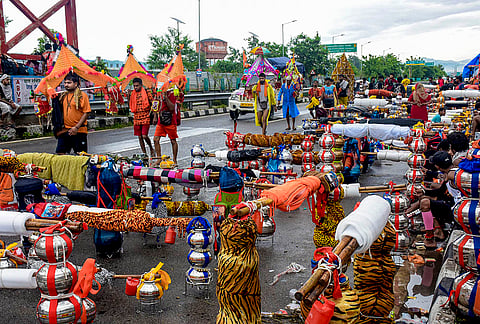 'Kawariyas' carry Ganga water during the holy month of 'Sawan', in Haridwar, Uttarakhand.