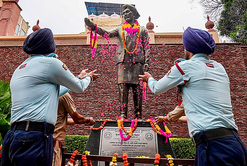 Security personnel pay floral tribute to the statue of freedom fighter Shaheed Udham Singh on his martyrdom day, at Jallianwala Bagh in Amritsar, Punjab. Udham Singh was hanged by the British for assassinating Michael O'Dwyer to avenge the 1919 Jallianwala Bagh massacre.